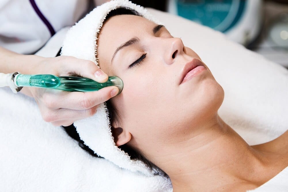 woman receiving facial cupping