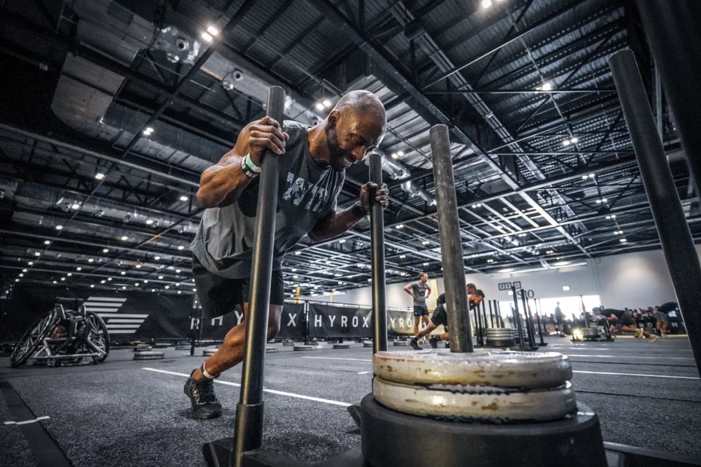 man sled pushing