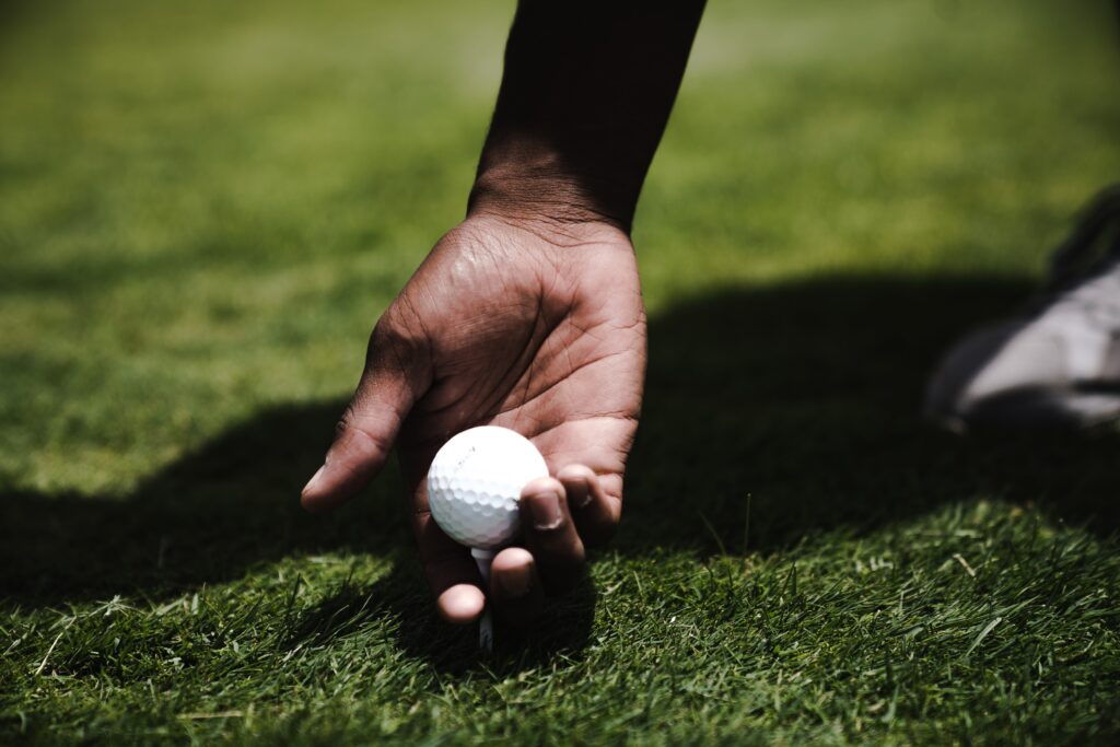 golf ball being teed up